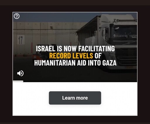 A still frame from a video. 

The frame has a large truck driving on a road.

There is text overlaid that says "Israel is now facilitating record levels of humanitarian aid into Gaza"